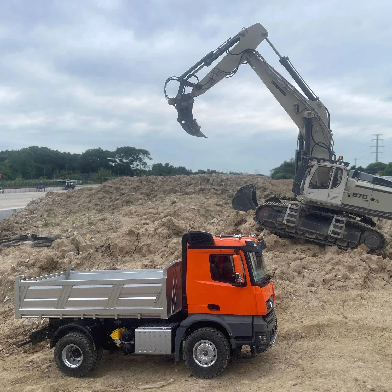 Excavator loading a haul truck on the sand face