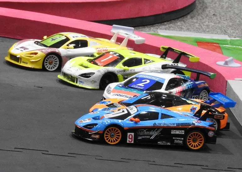 Cars on the circuit mid-heat